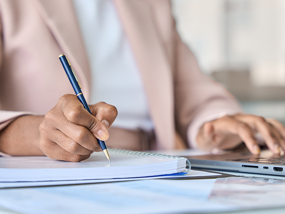 The essential checklist for your corporate event A woman ticks off a conference checklist